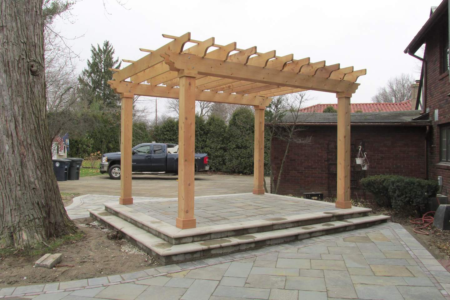 Covered patio structure over outdoor living space