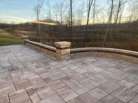 Outdoor living patio with built-in stone feature