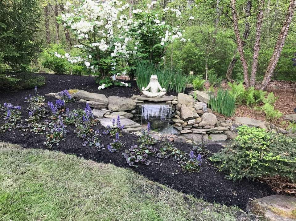 Stone water feature with planting accents